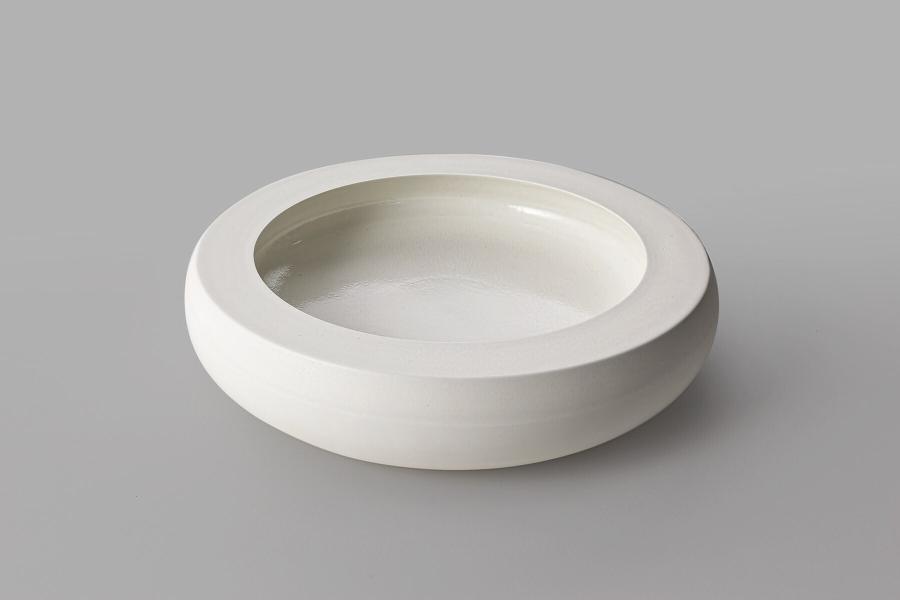 Large thick vessel form with flat rim