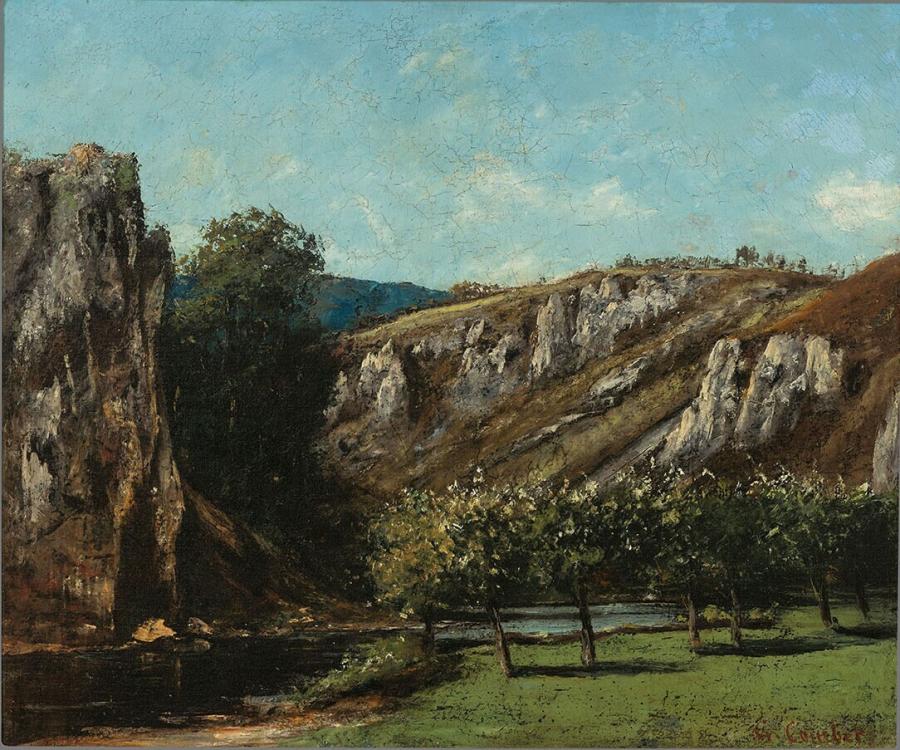 Mountainous landscape with fruit trees in Ornans