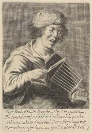jonge-man-die-een-rooster-bespeelt-als-muziekinstrument