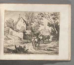 view-of-a-village-with-three-horse-drawn-carts